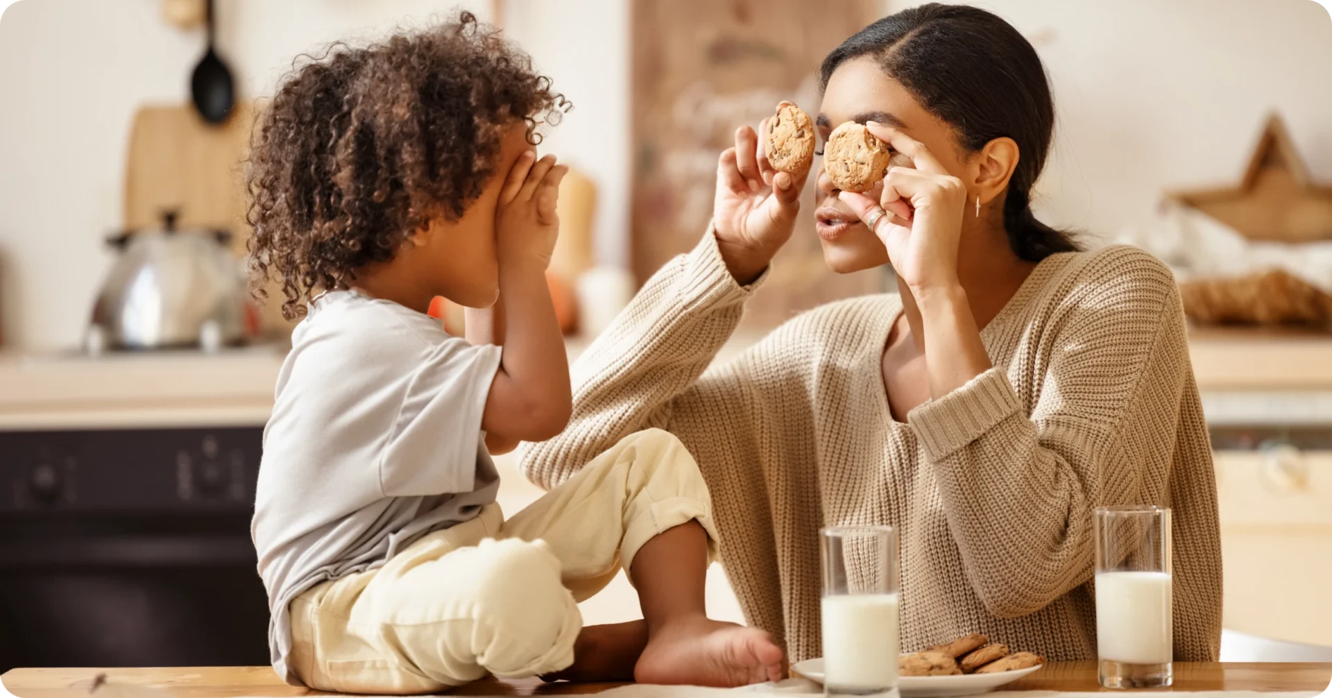 Playful kitchen moment with milk and cookies