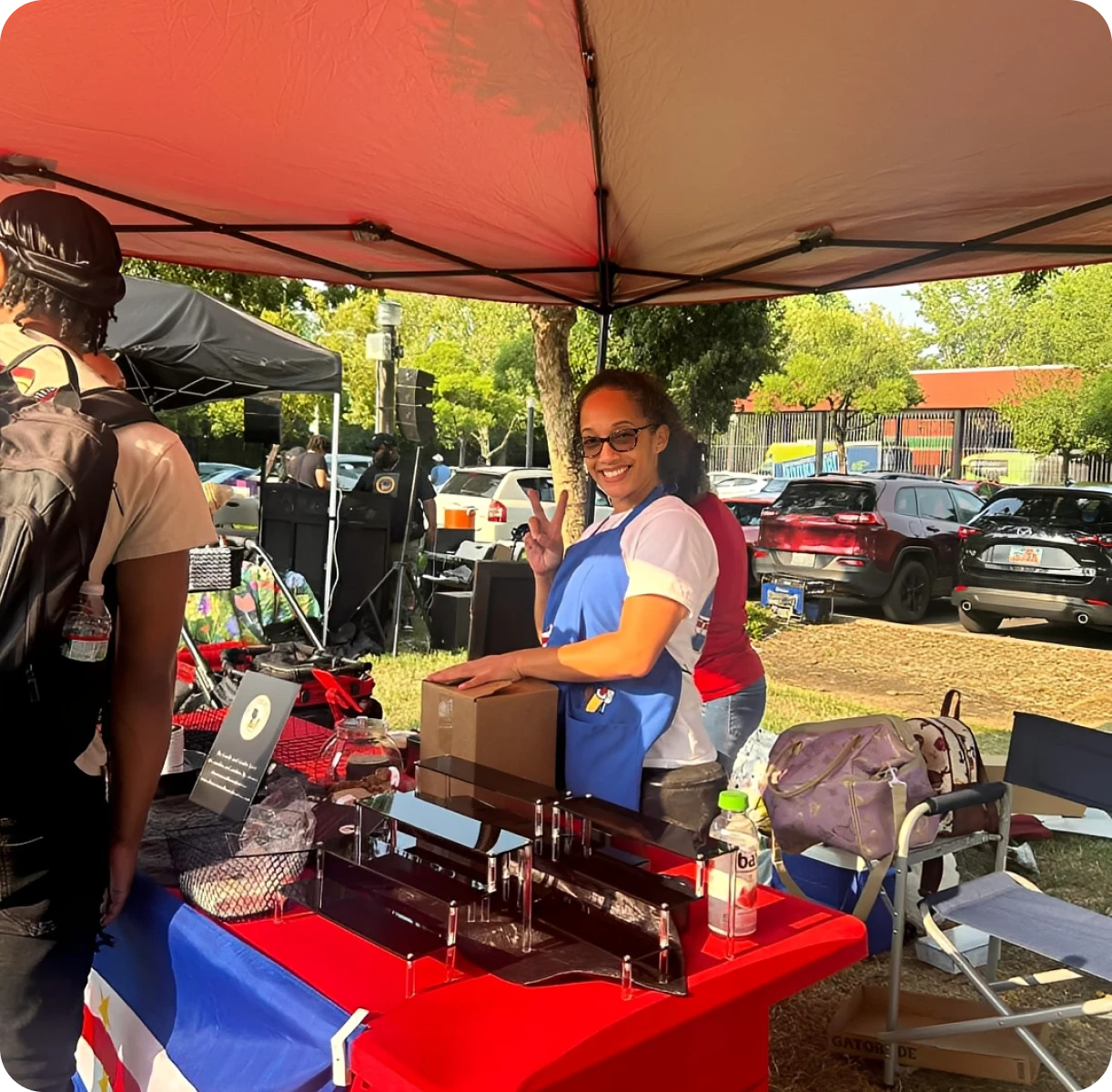 Smiling vendor at outdoor market stall