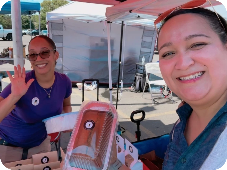 Friendly sellers at a food stand